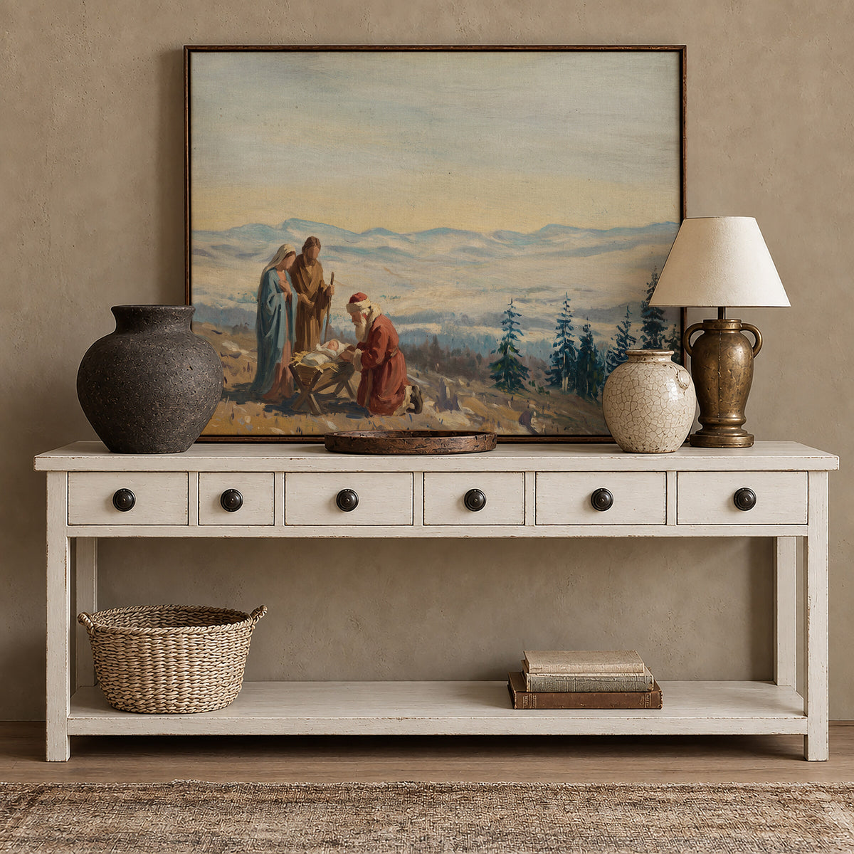 Nativity on the Mountain framed wall art above a white console with brass accents