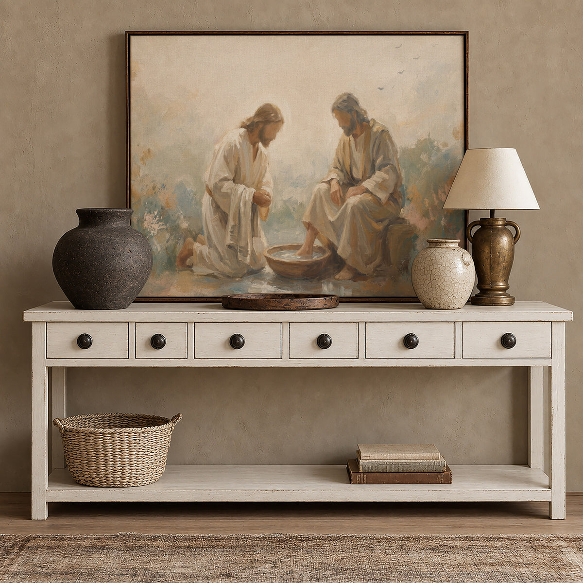 He Washed Their Feet framed wall art above a white console with brass accents