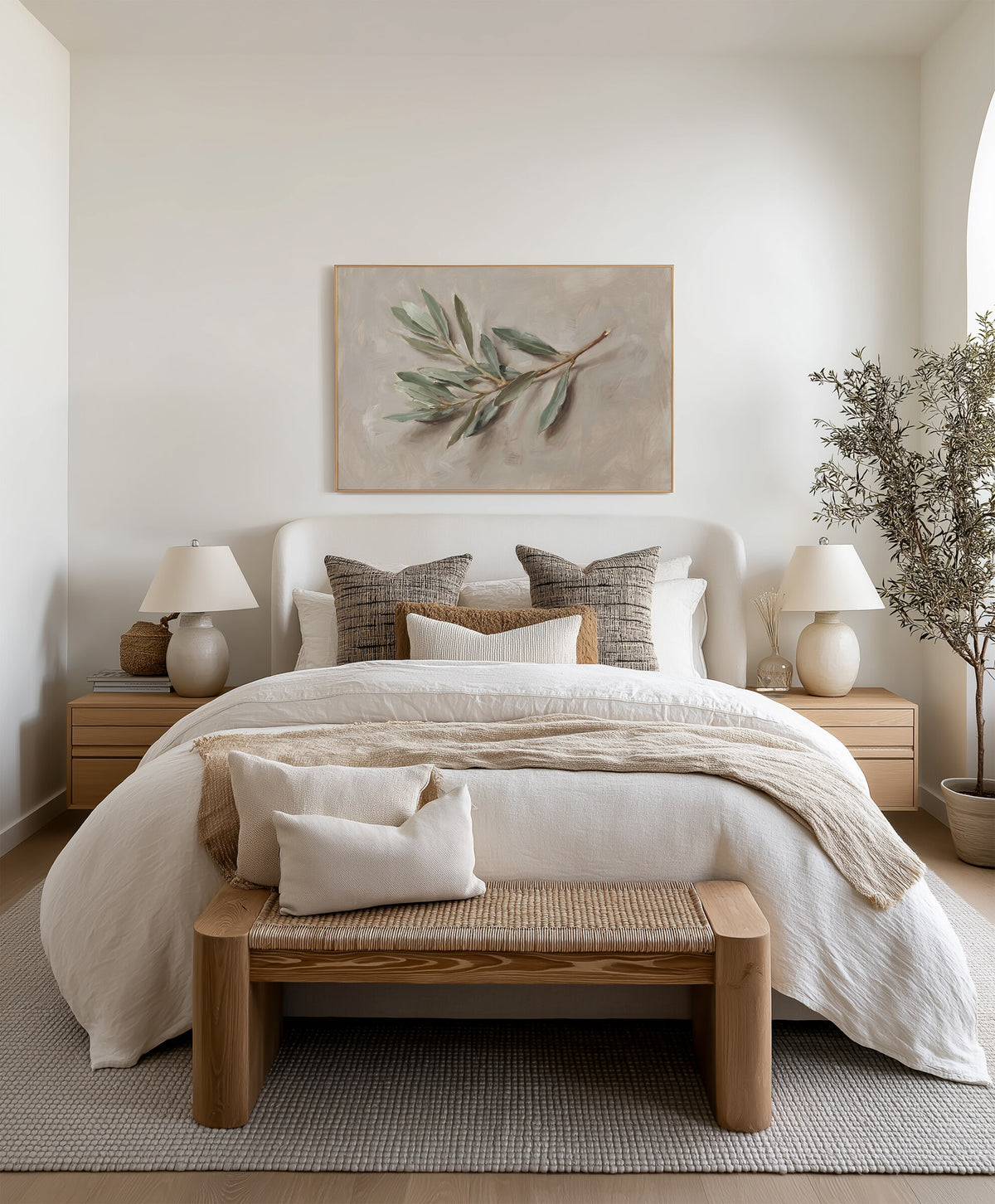 The Single Olive Sprig framed wall art above the bed in a bright bedroom