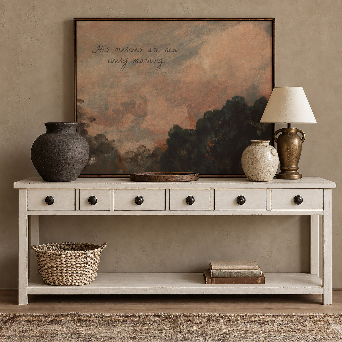 Mercies at Rose Sunrise framed wall art above a white console with brass accents