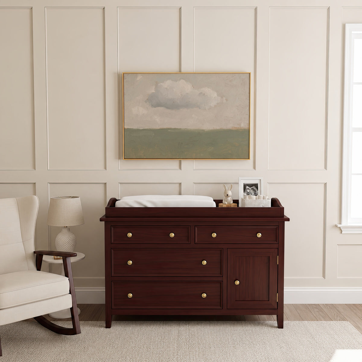 One Cloud Over Sage Field framed wall art above a brown dresser in a classic nursery