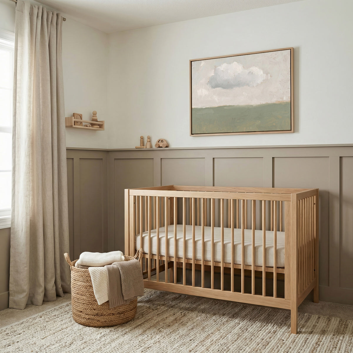 One Cloud Over Sage Field framed wall art above a crib in a taupe nursery
