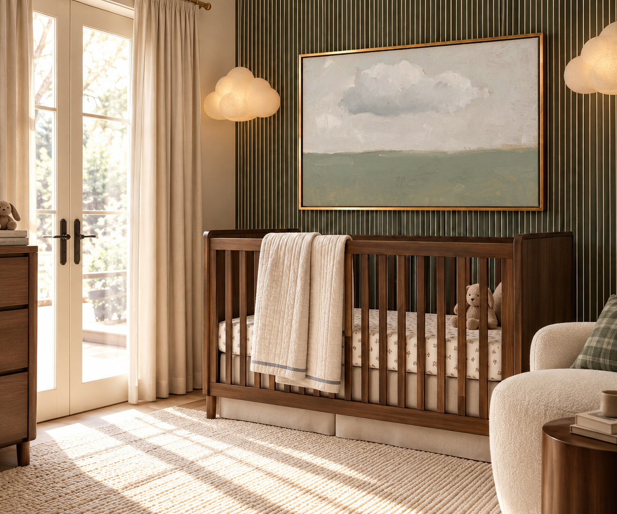 One Cloud Over Sage Field framed wall art in a striped-wall nursery