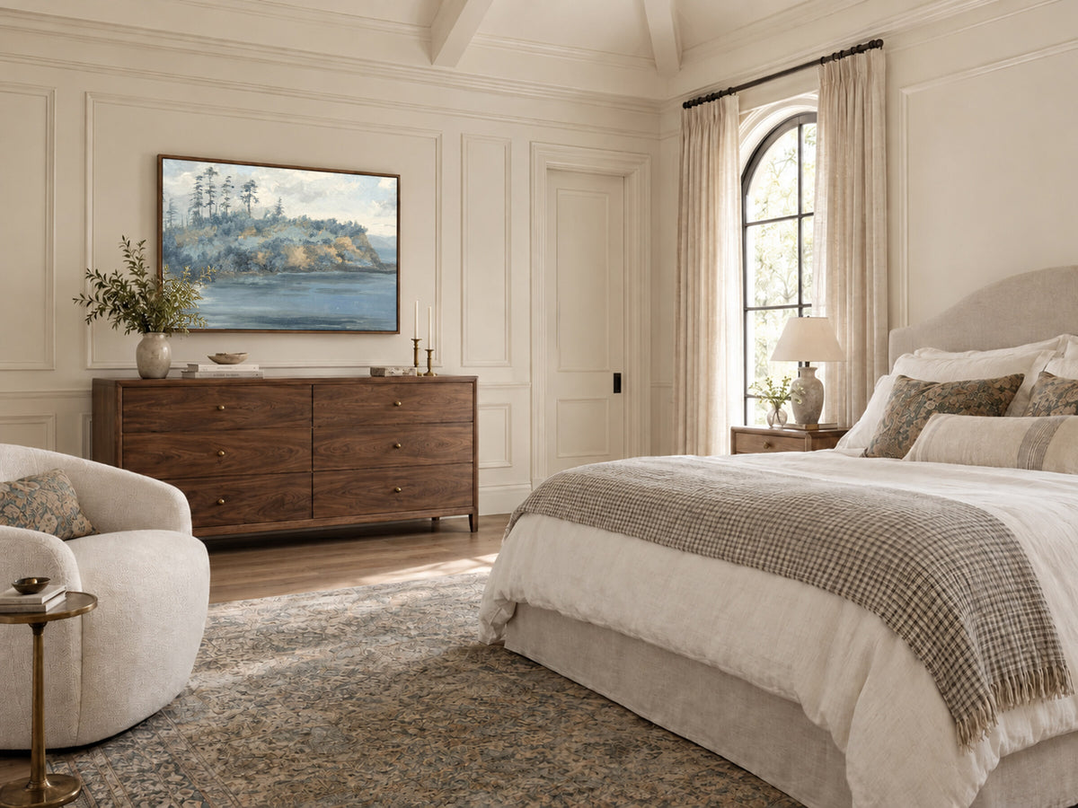 Blue Impressionist Headland framed wall art in a bedroom above a walnut dresser