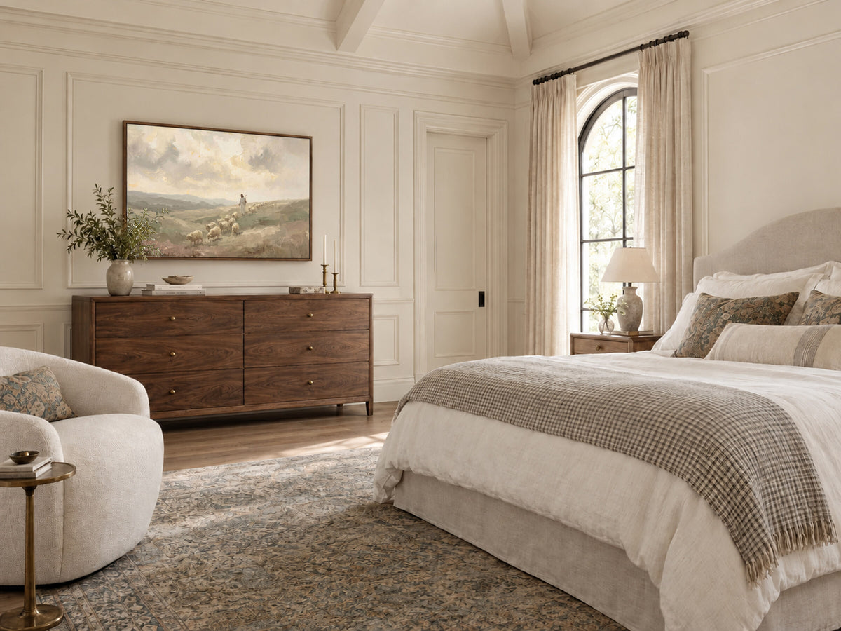 Down the Slope with the Flock framed wall art in a bedroom above a walnut dresser