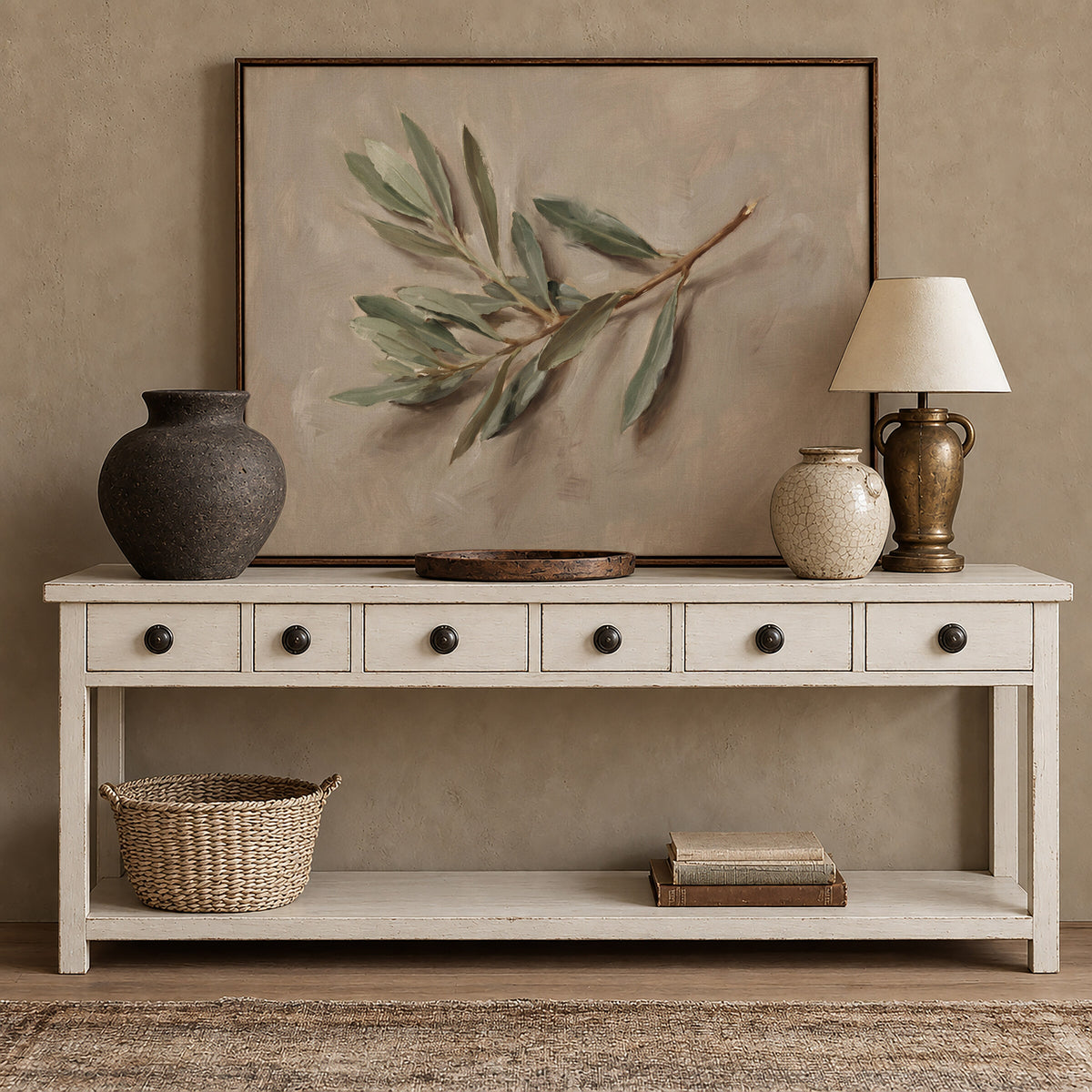 The Single Olive Sprig framed wall art above a white console with brass accents